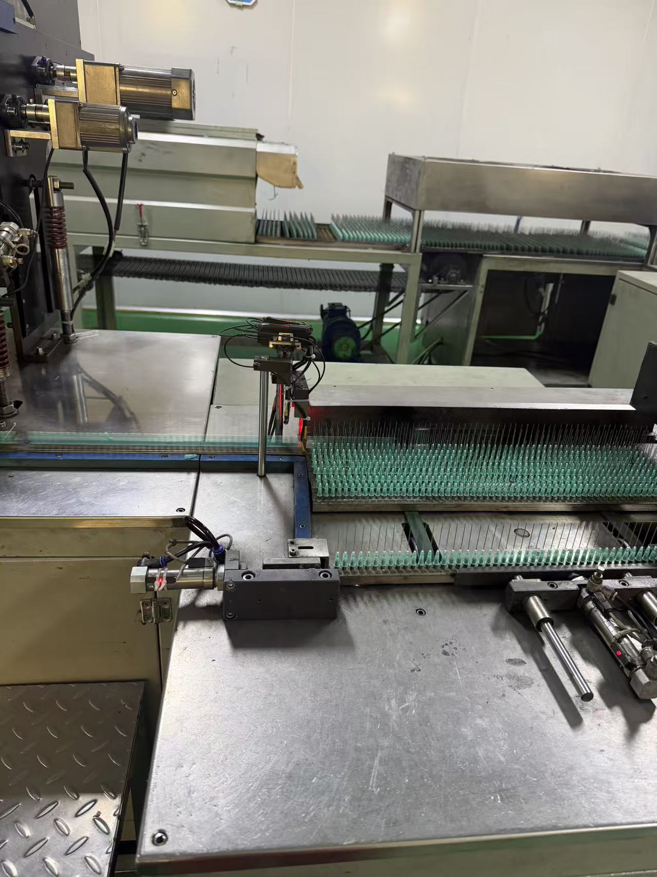 Adhesive needle applicator.