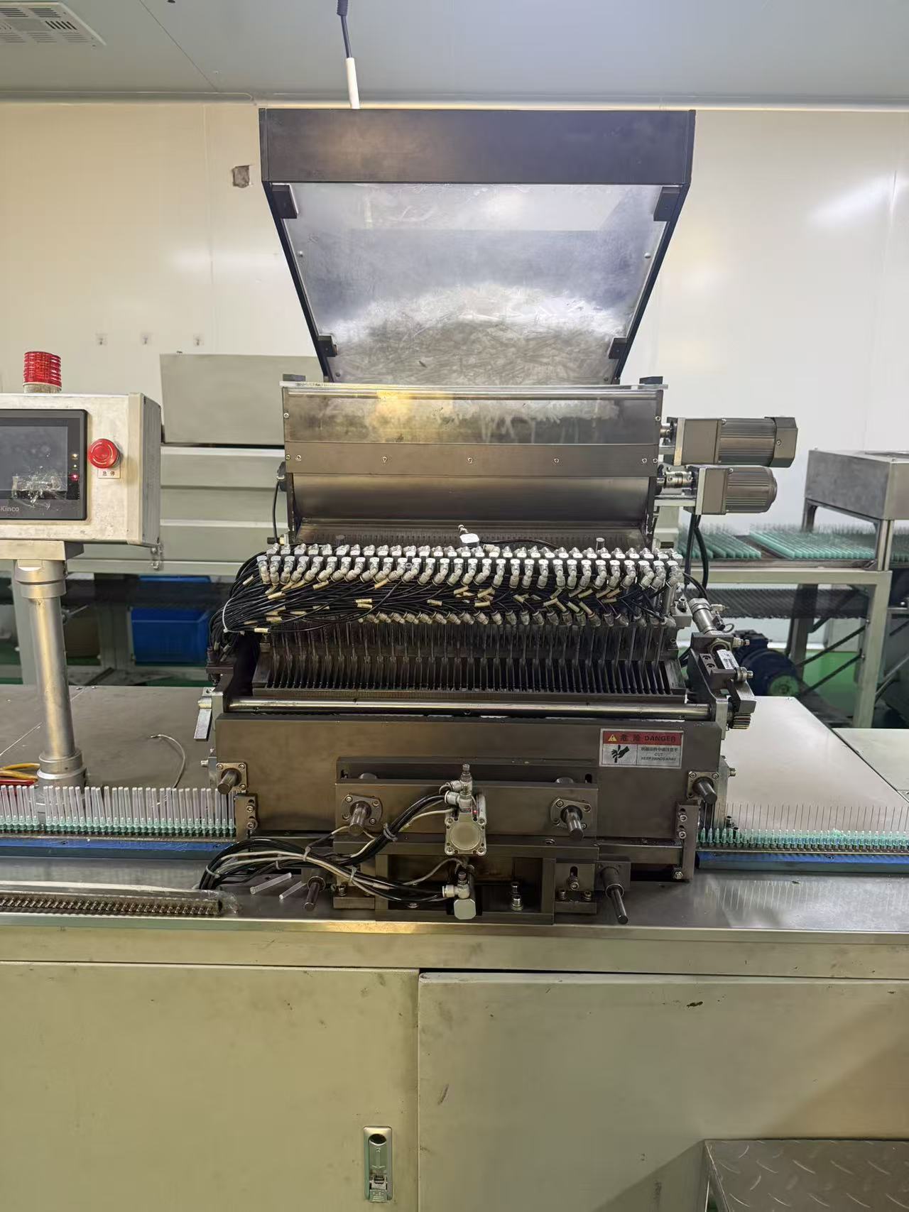 Adhesive needle applicator.