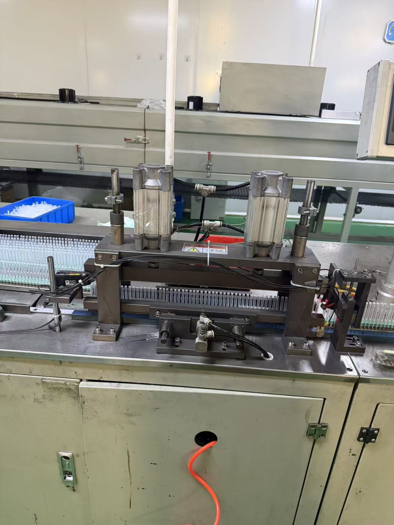 Adhesive needle applicator.