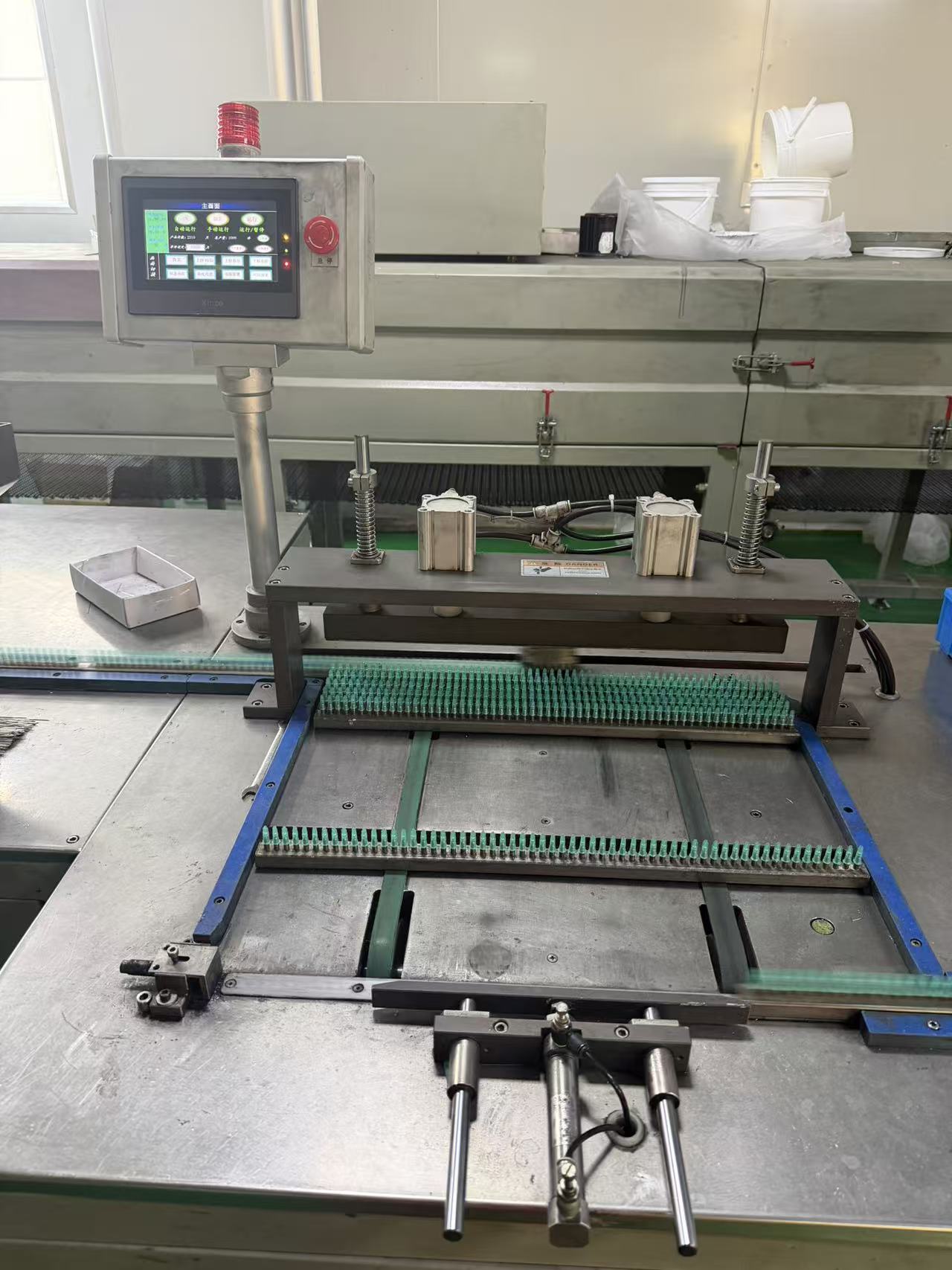 Adhesive needle applicator.