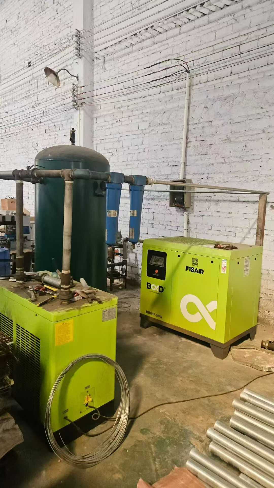A set of three 22-kilowatt screw-type permanent magnet variable frequency air compressors from the Baoder brand for the year 2023.