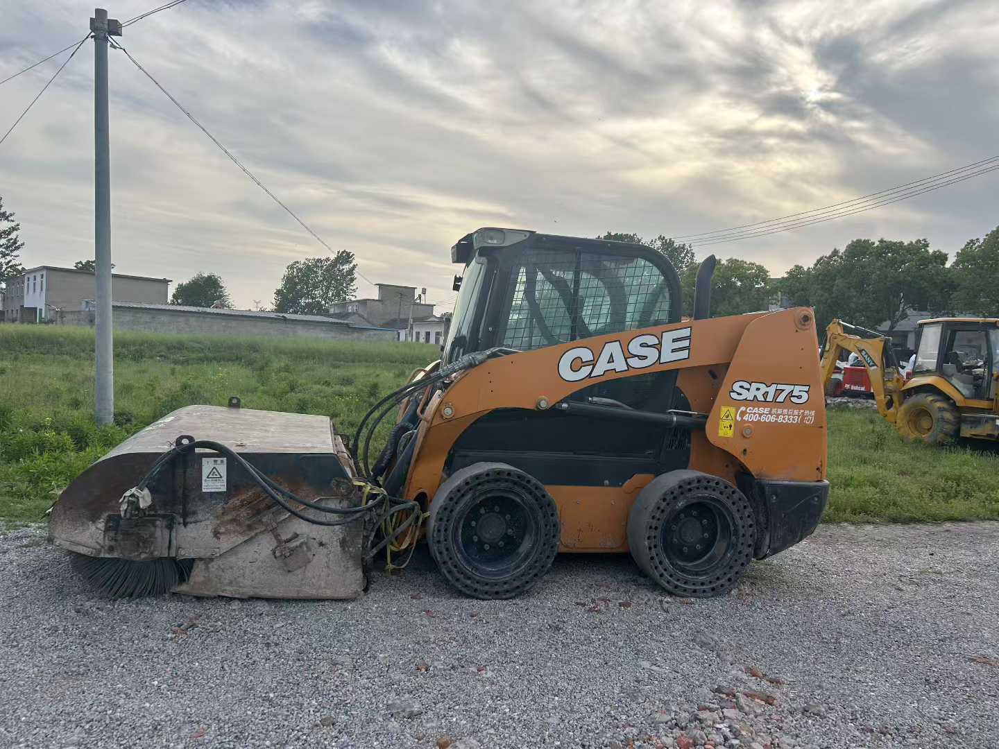 Two CASE Case SR175 sliding loader machines.