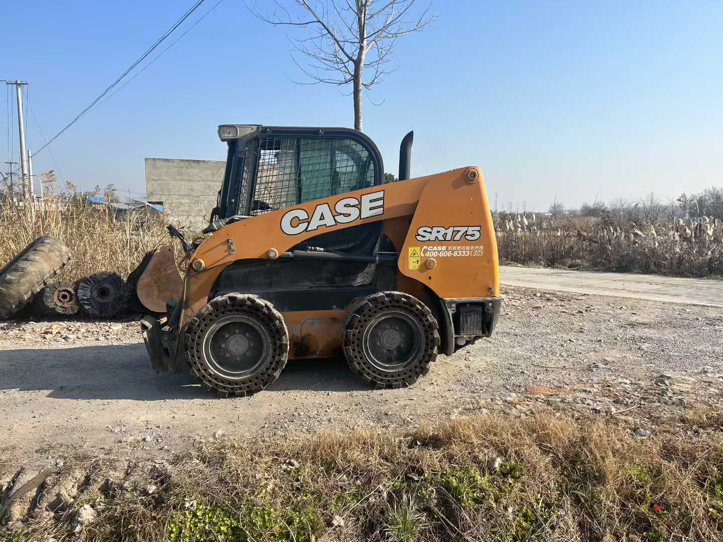 Two CASE Case SR175 sliding loader machines.