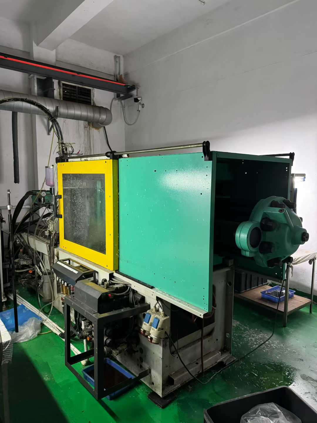Two ABG 100T liquid silicone injection machines, equipped with two Kawasaki feeding systems.