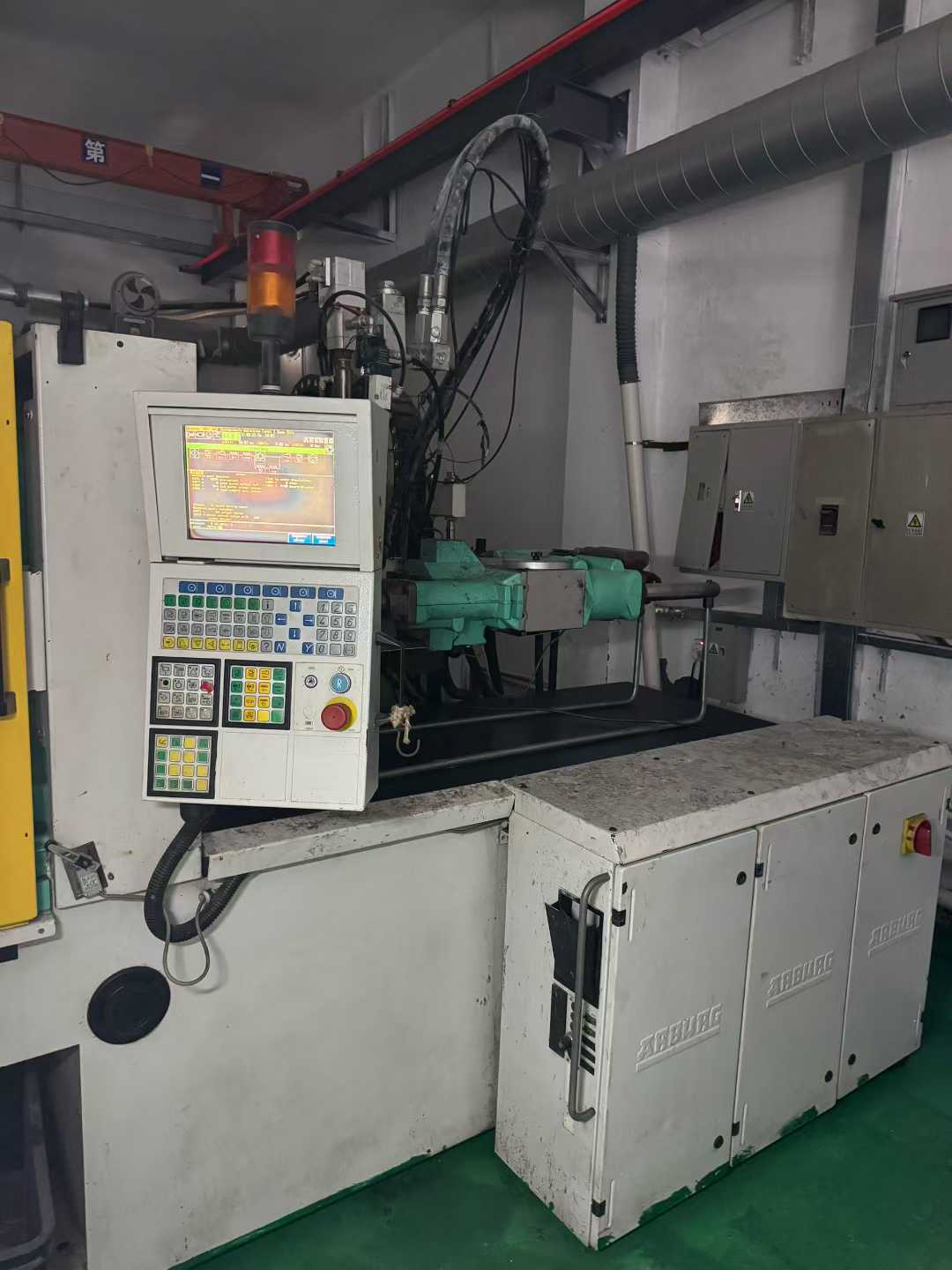 Two ABG 100T liquid silicone injection machines, equipped with two Kawasaki feeding systems.