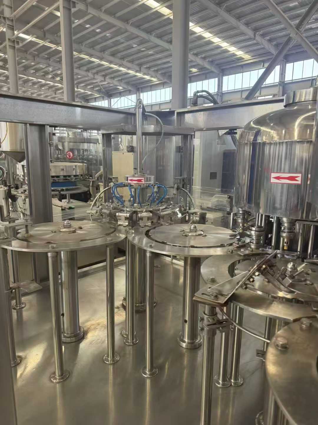 12 units of 30-mouth filling machines with waterfall top covers and sanitized lids!