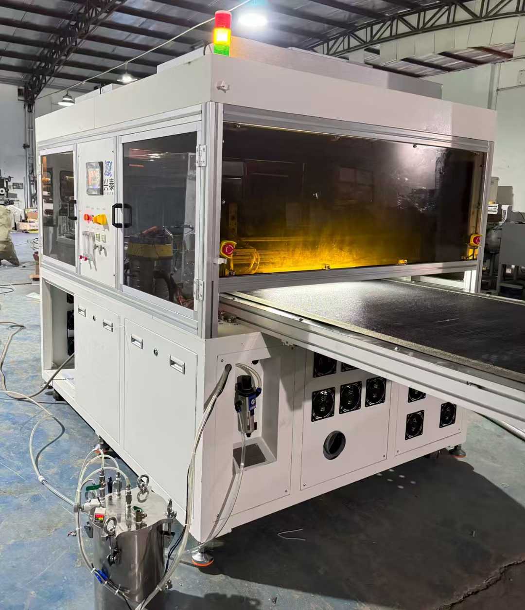 A double plasma coating machine with a 1m wide web belt, highly equipped, year 2021.
