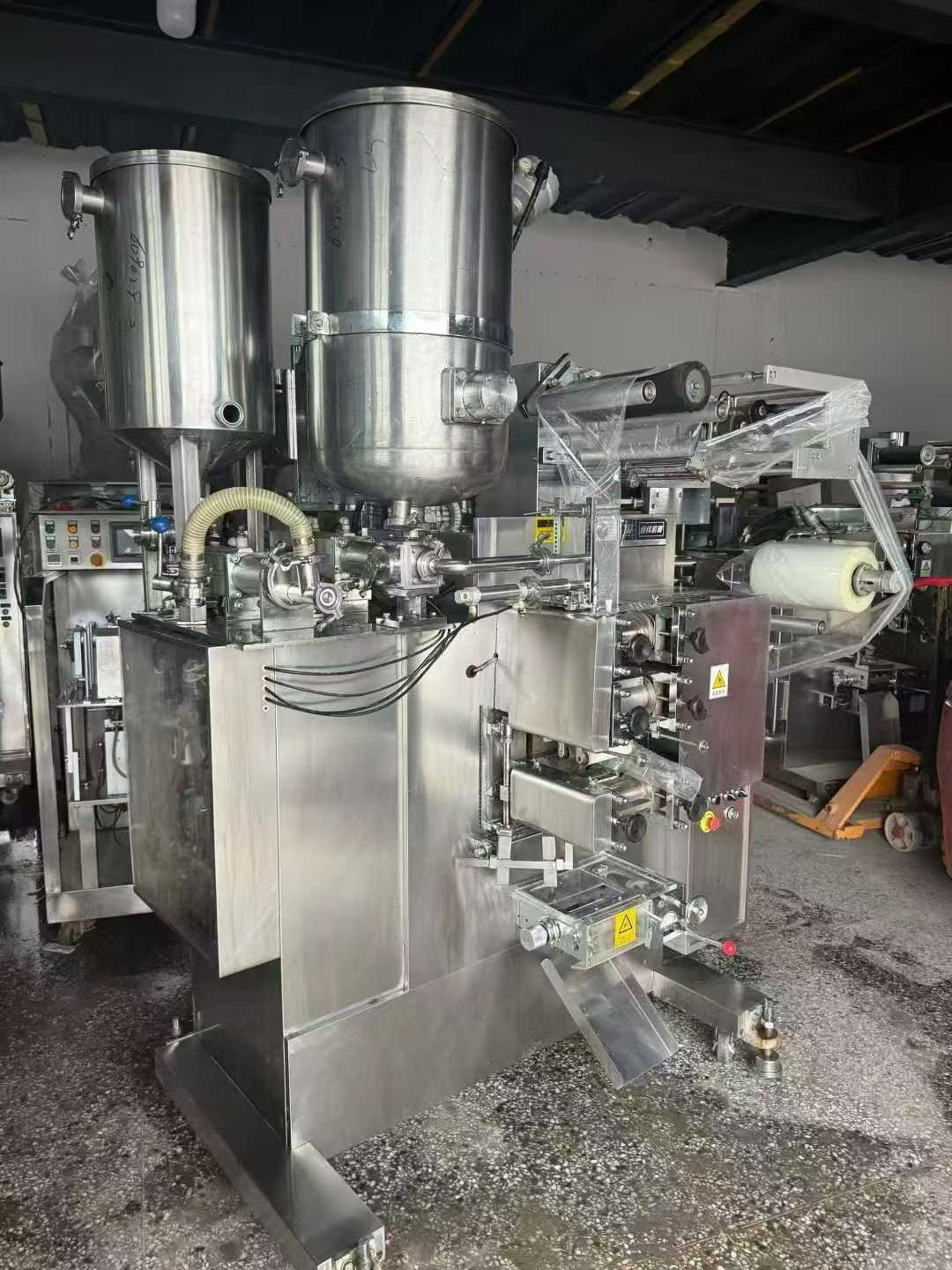 Two Jingwei JG3300 sauce filling machines; the machines have not been used much.