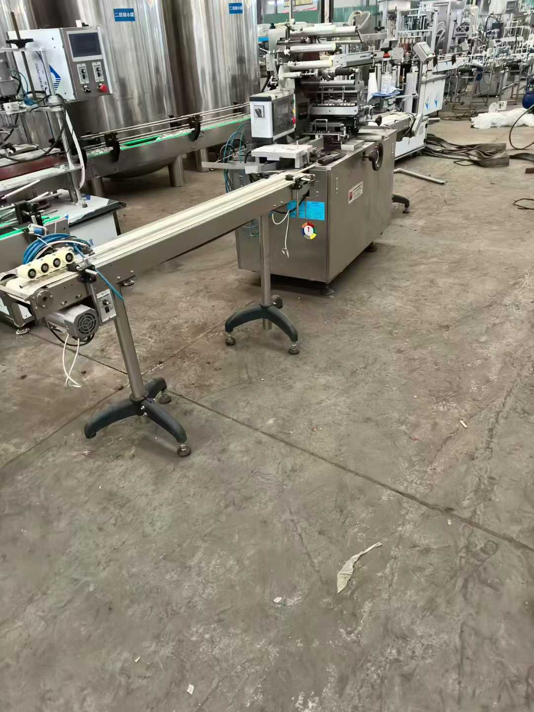 3-ton water storage tank, cigarette wrapper machine, 250-roll pillow packaging machine, box-sealing machine.