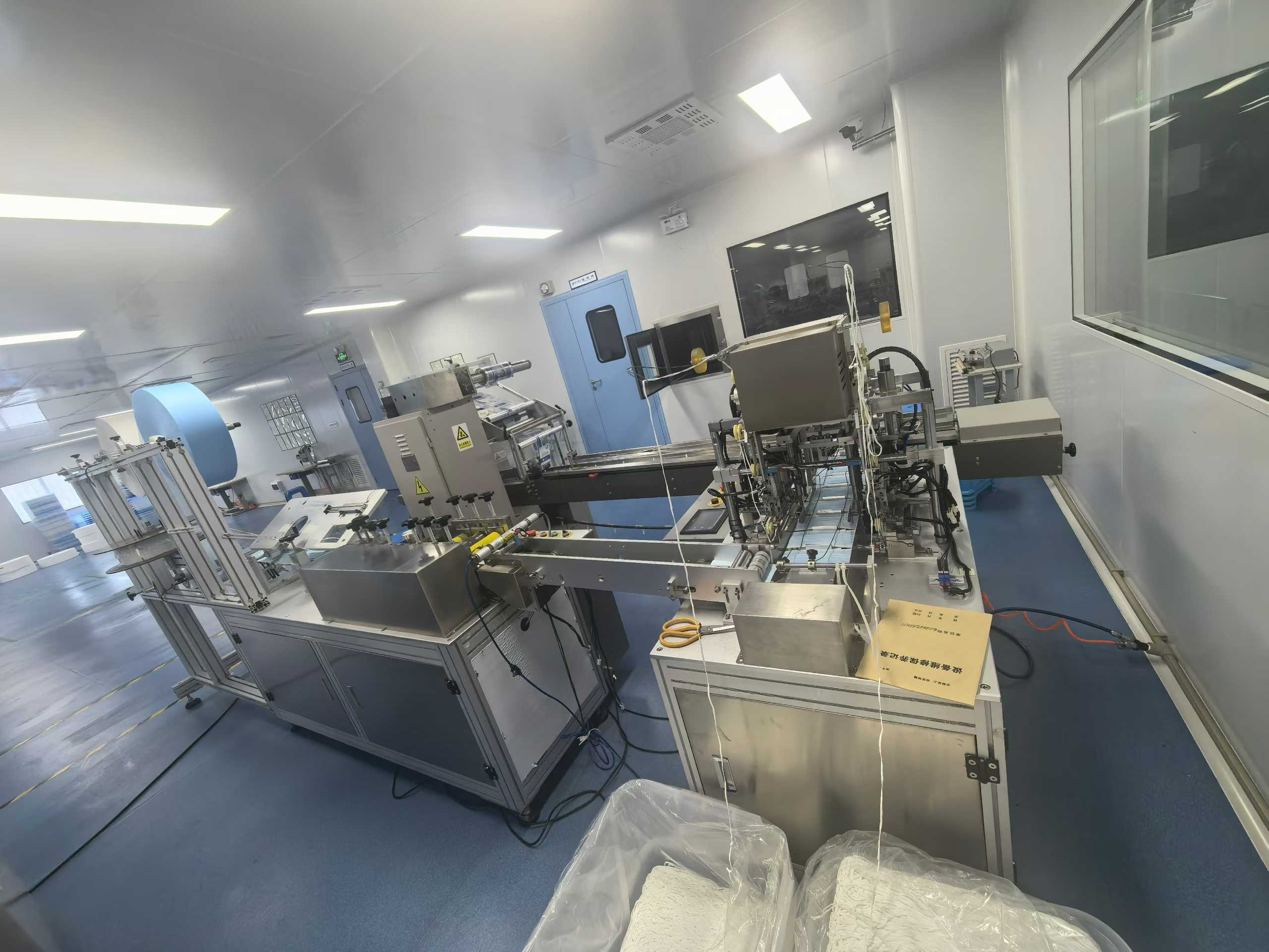 2 flat-sheet one-to-one mask production machines.