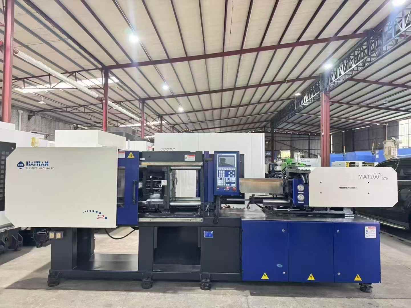 Haitian Tianlong II MA120II servo machine.