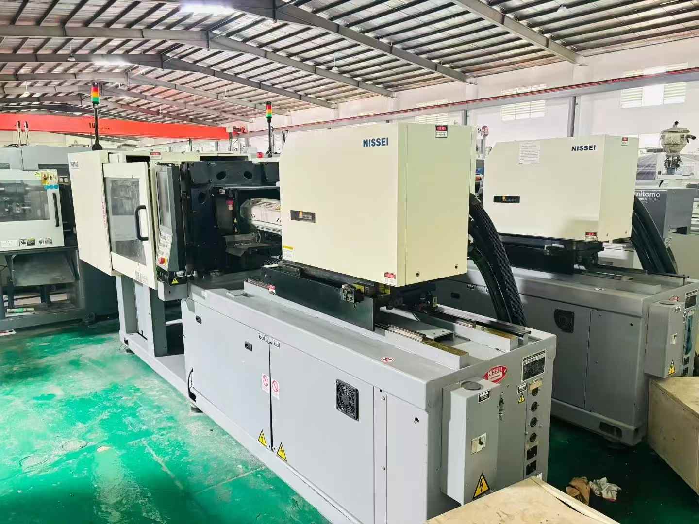 Nissin 80-ton fully electric injection molding machine, 500 spm, 26-bar units.
