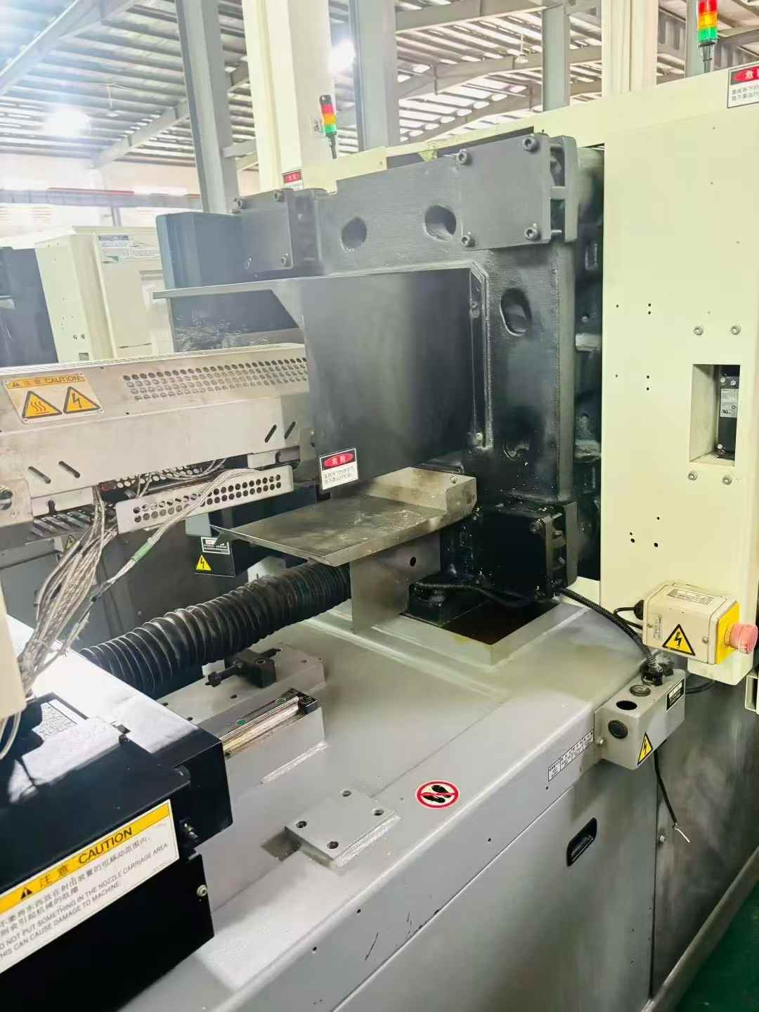 Nissin 80-ton fully electric injection molding machine, 500 spm, 26-bar units.