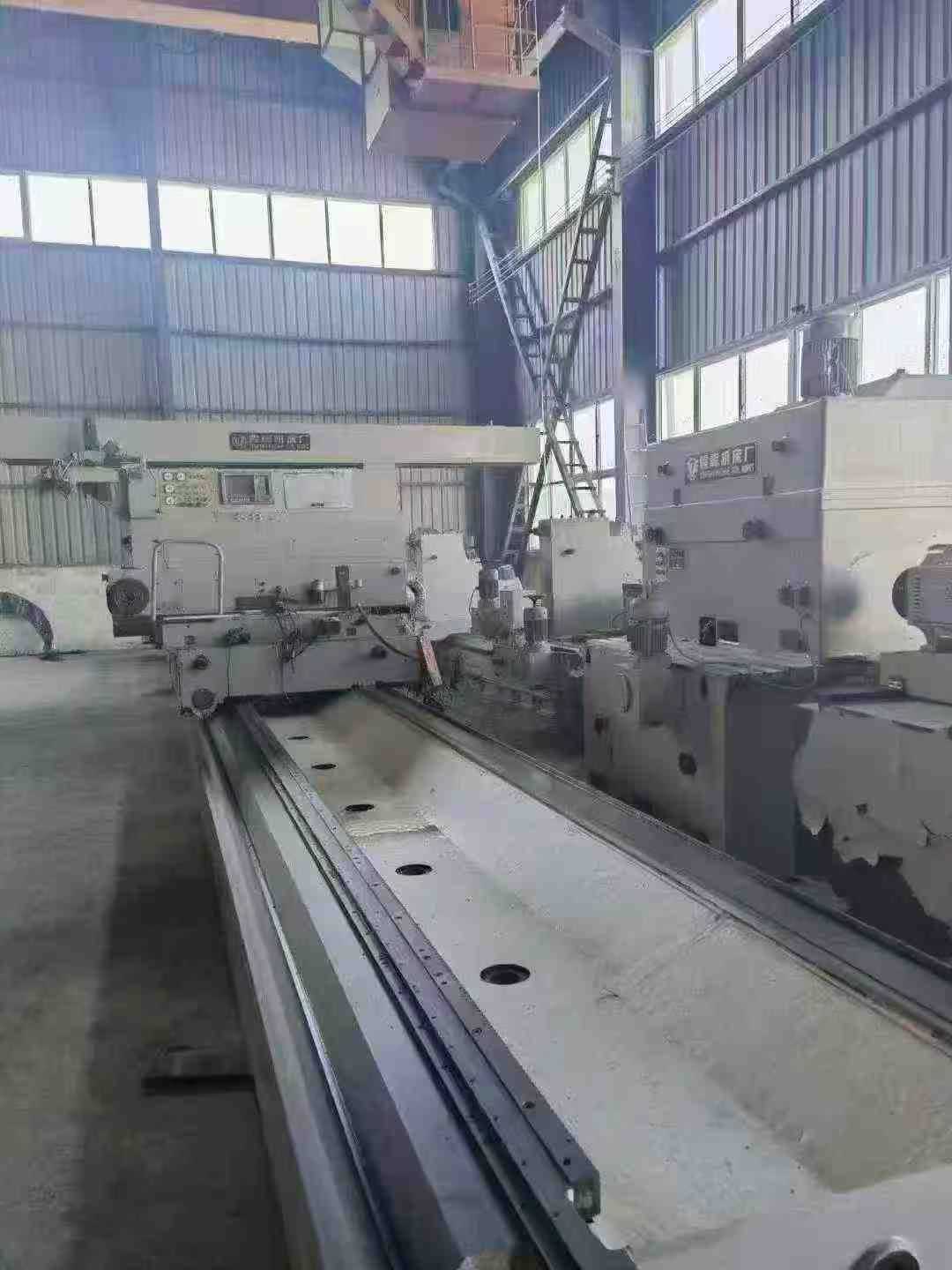Heavy-duty CNC roll grinder.