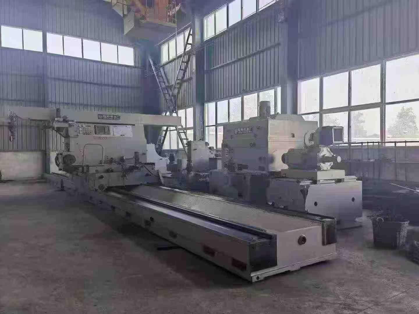 Heavy-duty CNC roll grinder.