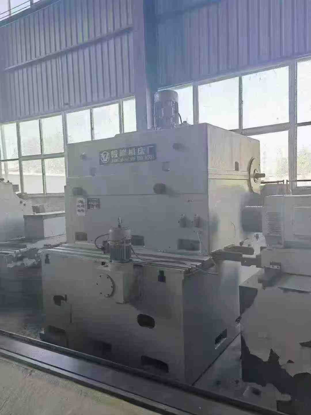 Heavy-duty CNC roll grinder.