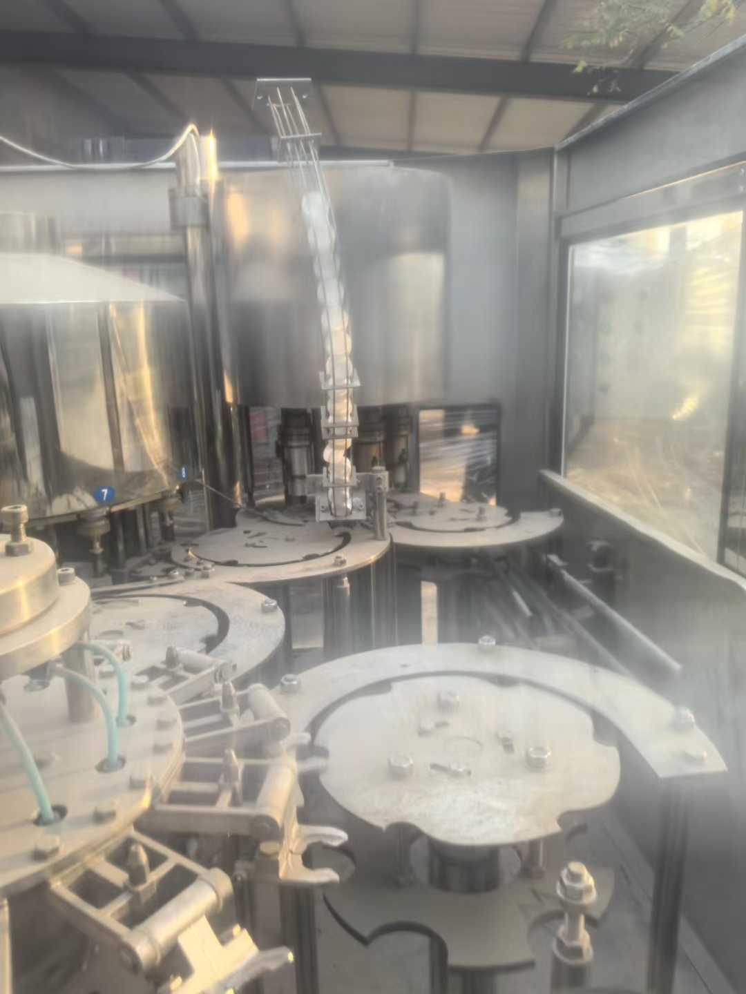 Sanxing Huaxing 12-head customized water filling machine.