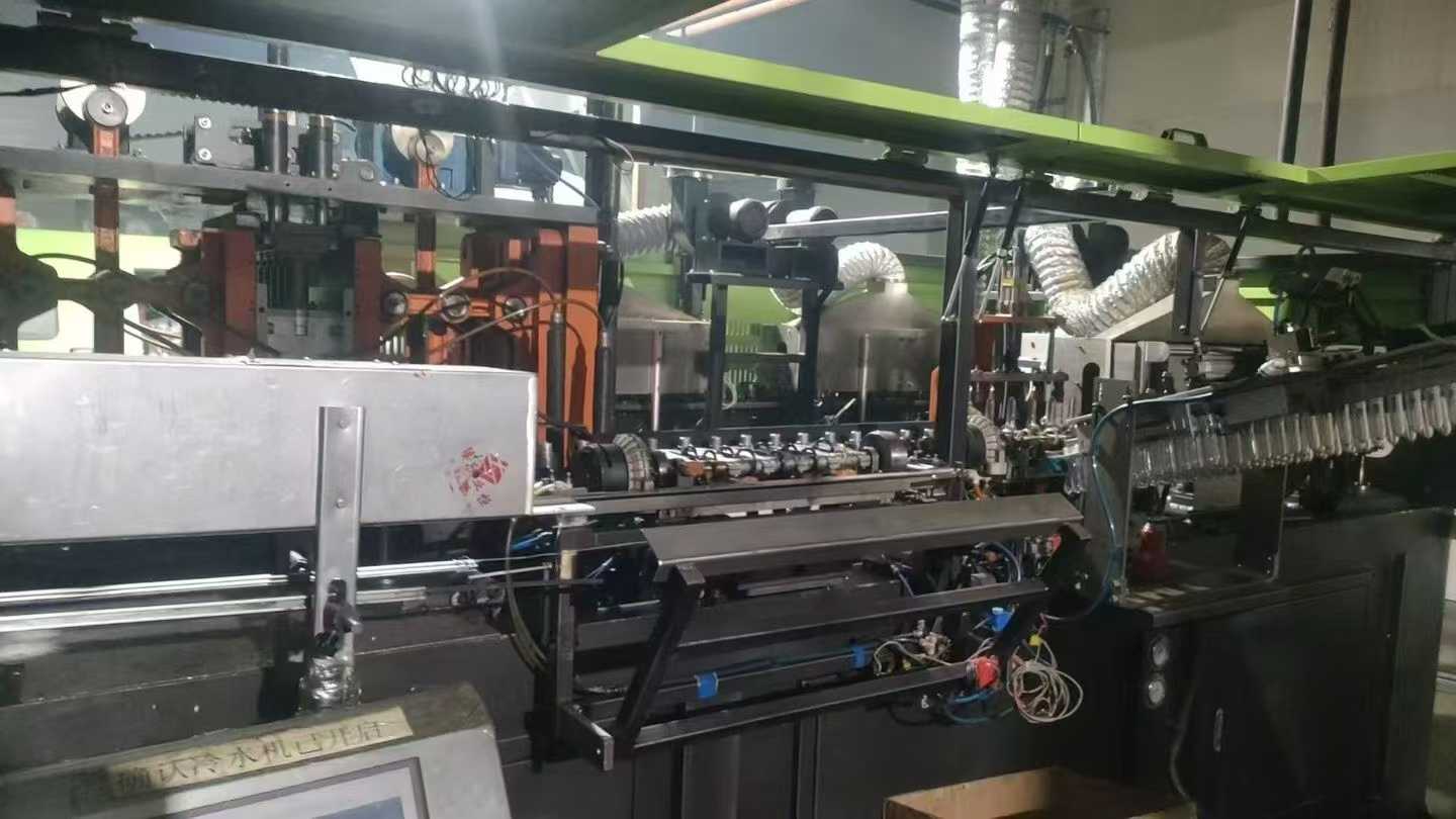 RiBo Blow Molding Machine, one output for six units, with three sets of molds.