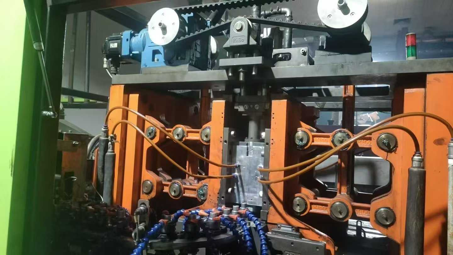 RiBo Blow Molding Machine, one output for six units, with three sets of molds.