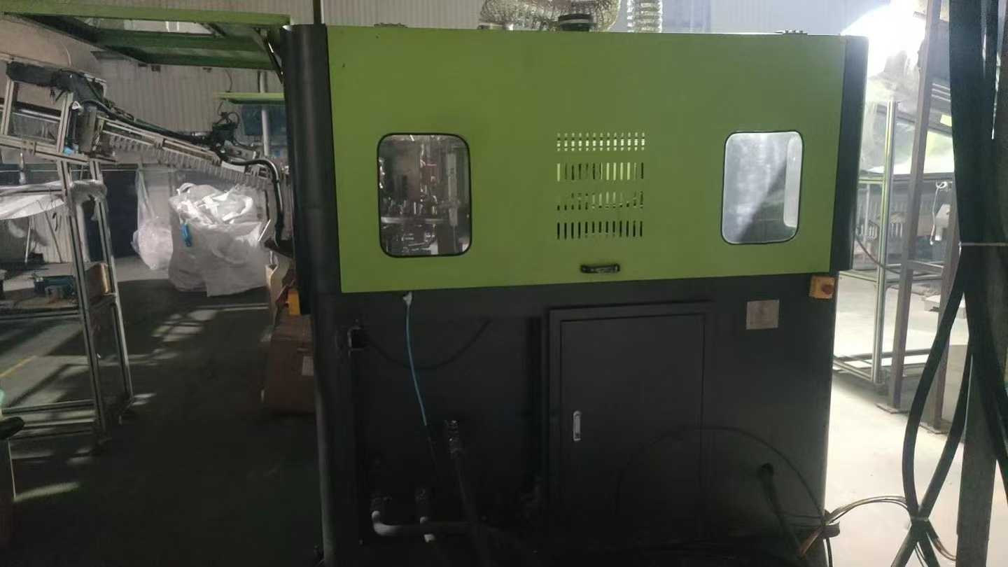 RiBo Blow Molding Machine, one output for six units, with three sets of molds.