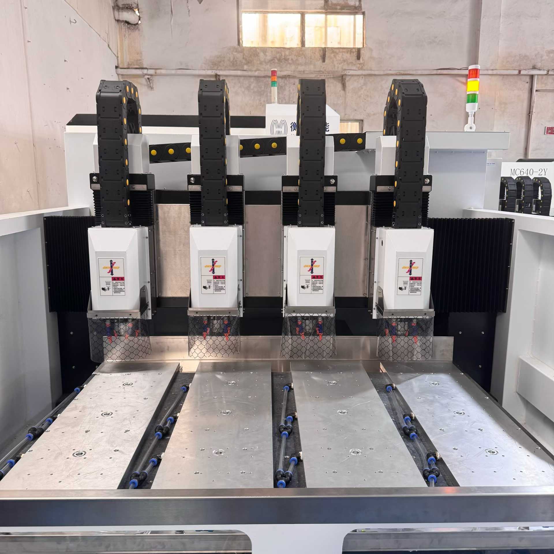 Zhenyi Precision 1390-4 CNC machine, travel range of 1320x970, ideal for creating vehicle central control touchscreens with long glass panels.