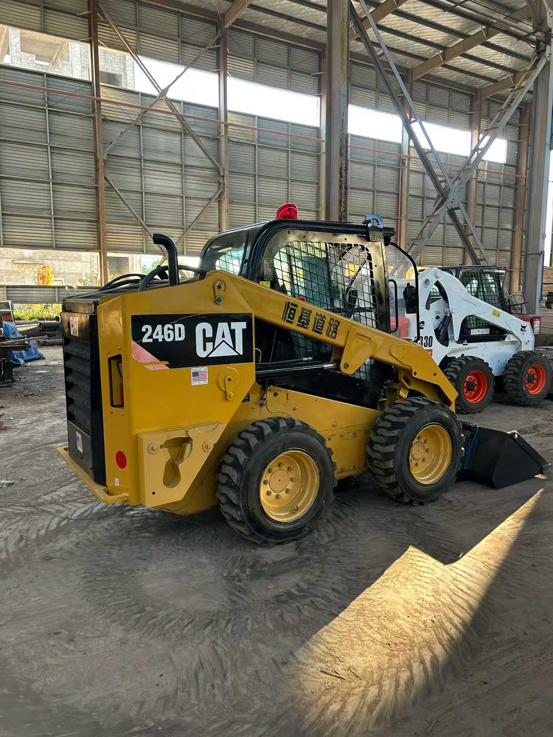 The Caterpillar 246D high-power sliding loader, featuring a brand-new bucket.