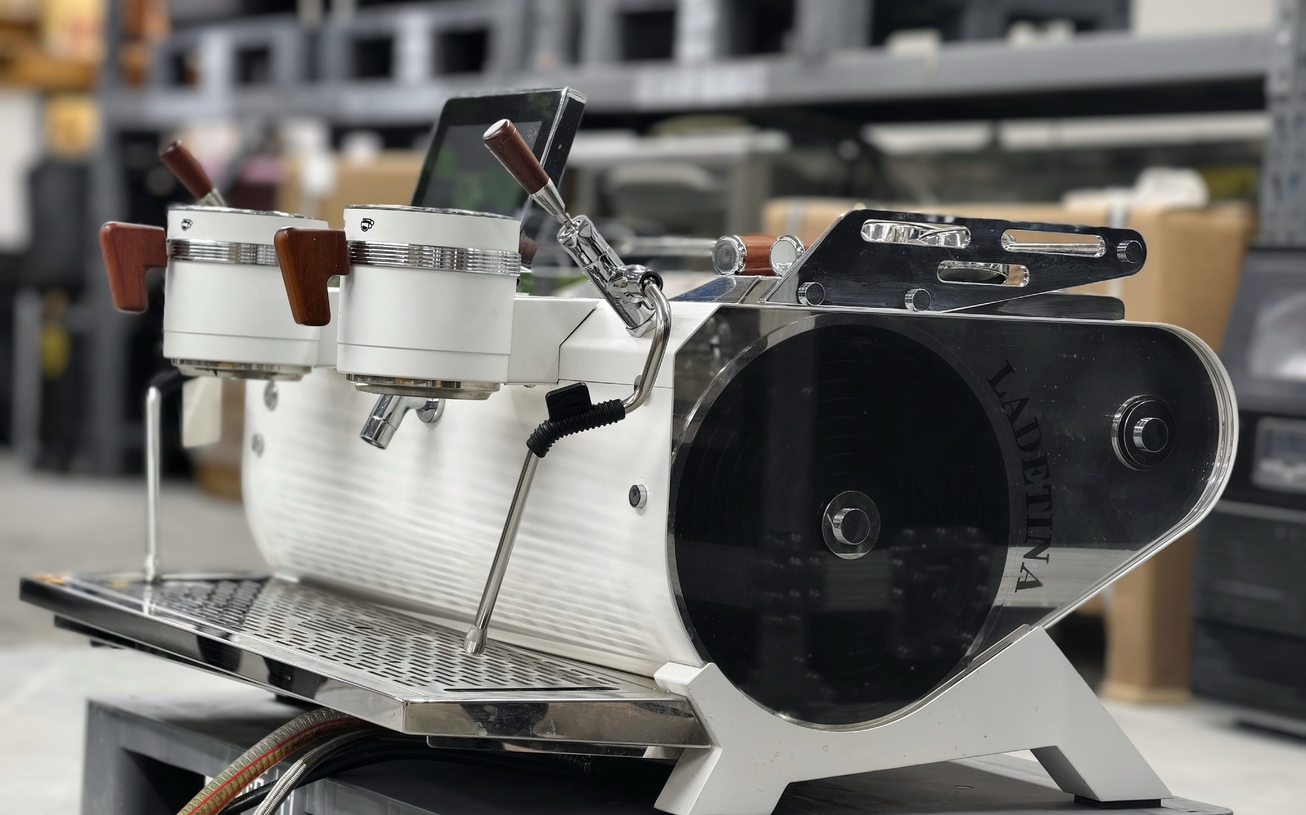 The Legendary Coffee Machine of 2025. Three boilers, rotating pumps. Saturated head. Features a small screen.