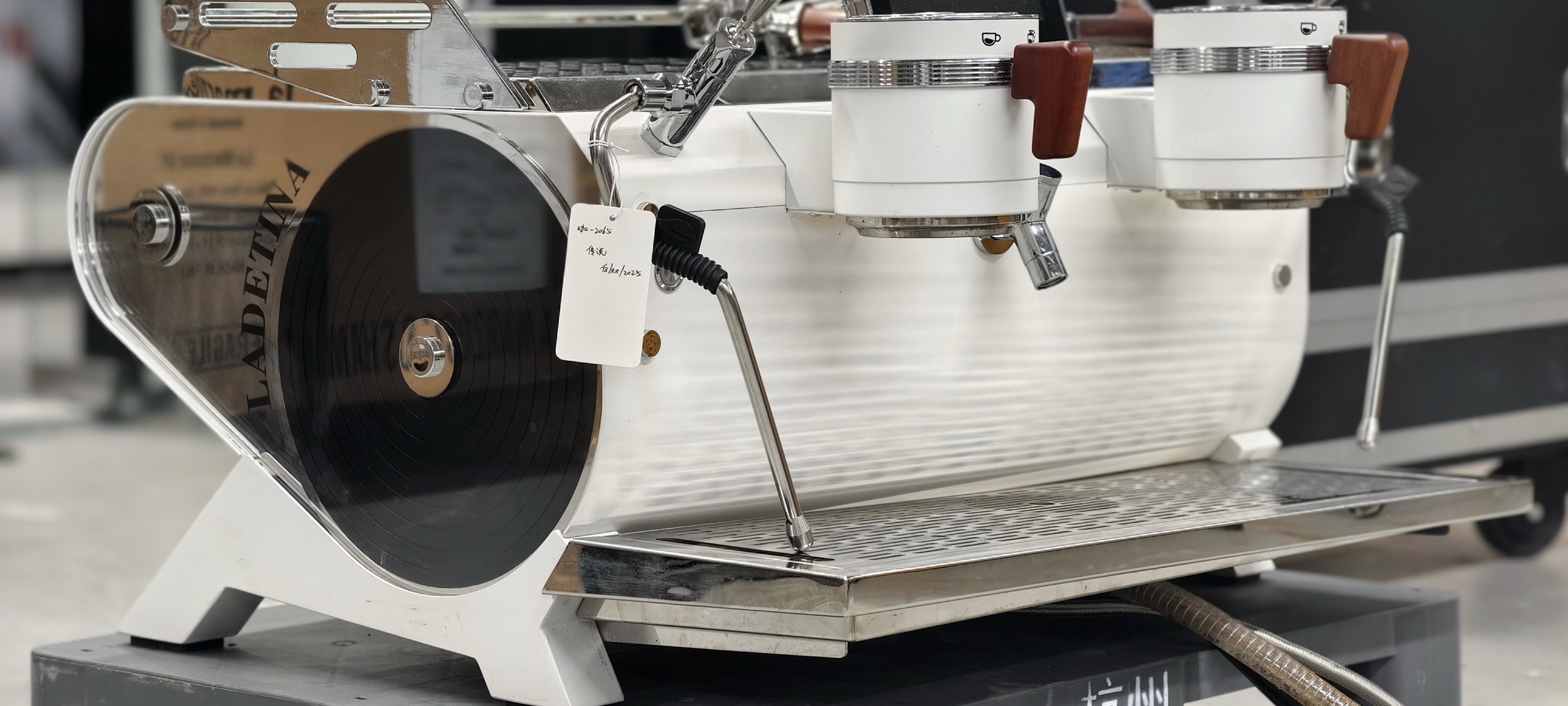 The Legendary Coffee Machine of 2025. Three boilers, rotating pumps. Saturated head. Features a small screen.