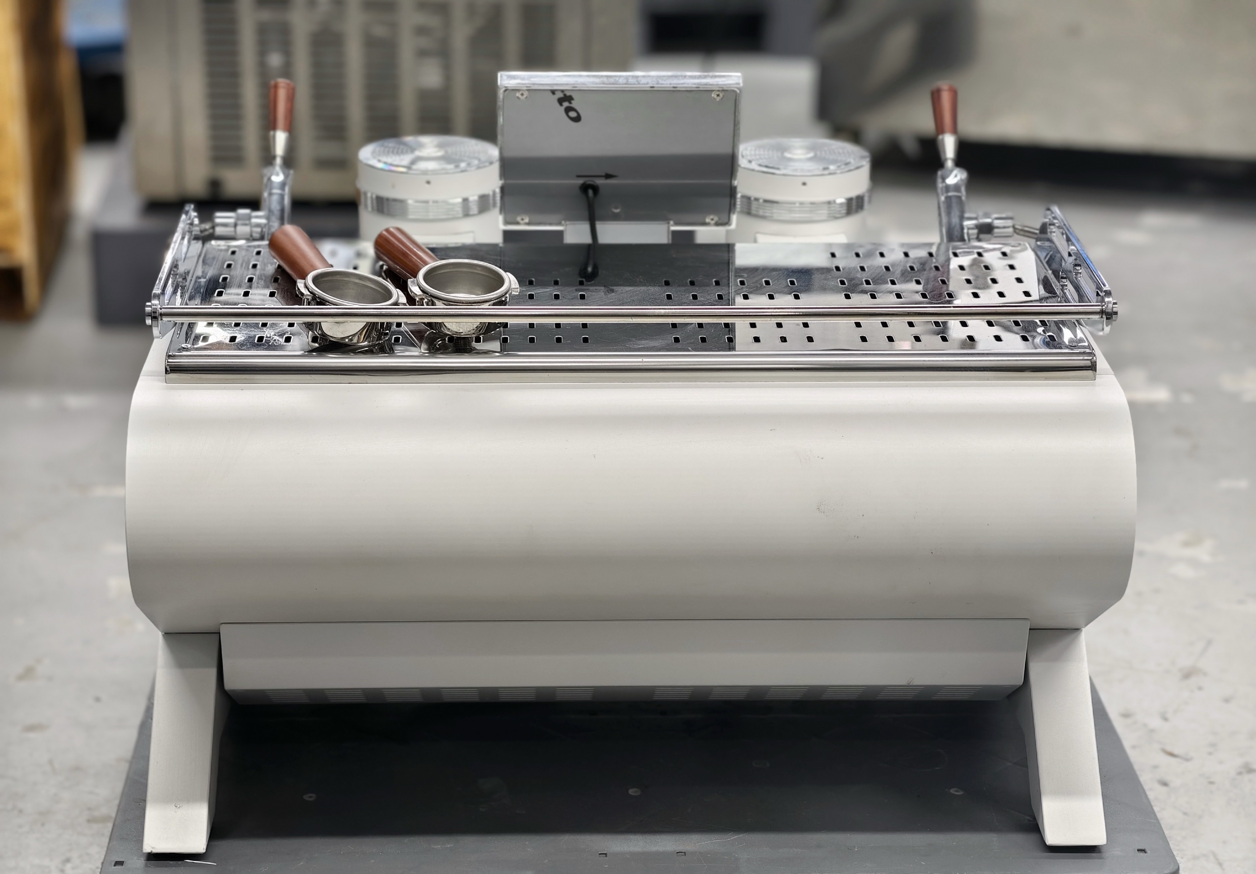 The Legendary Coffee Machine of 2025. Three boilers, rotating pumps. Saturated head. Features a small screen.